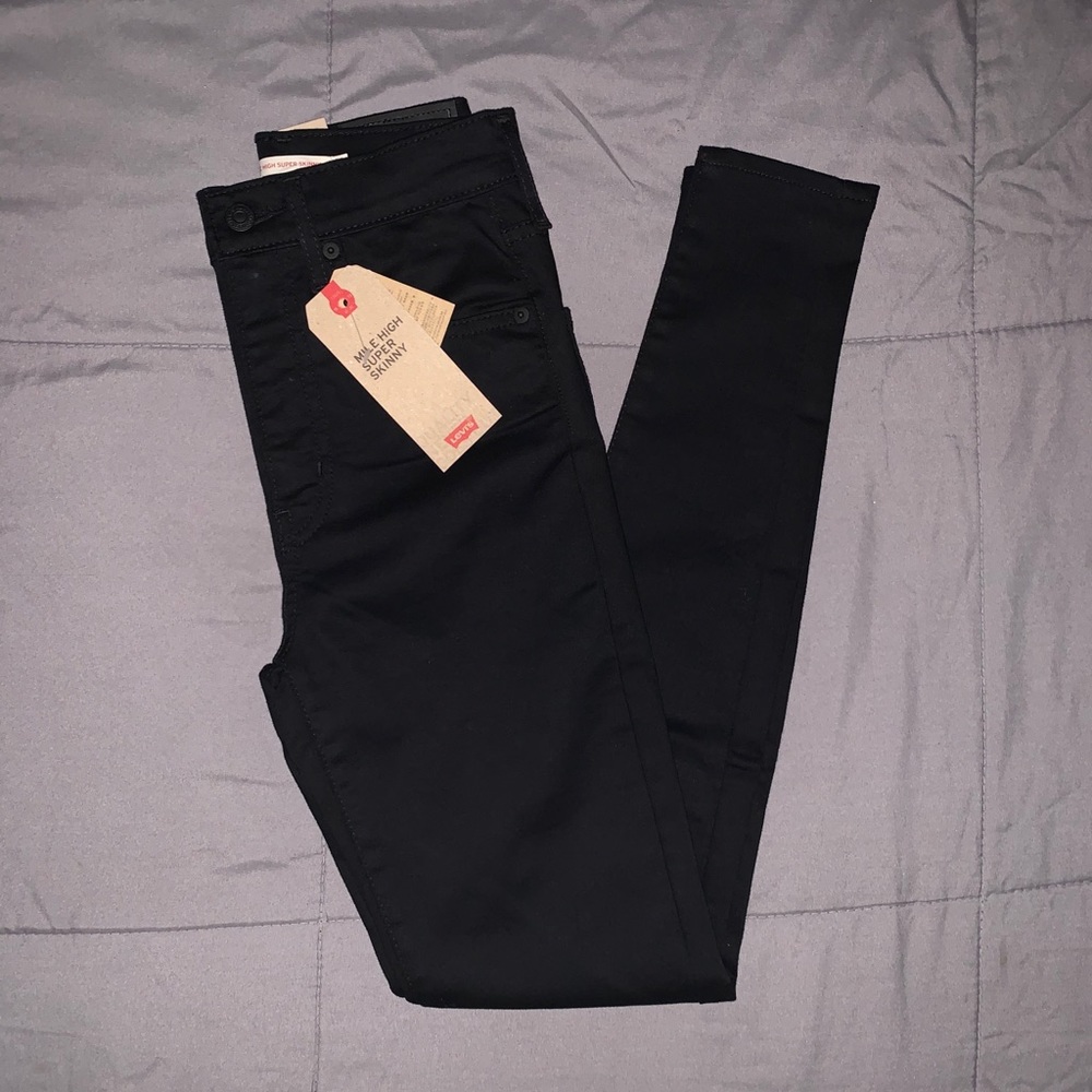 Pure black Levi jeans. [24/26]